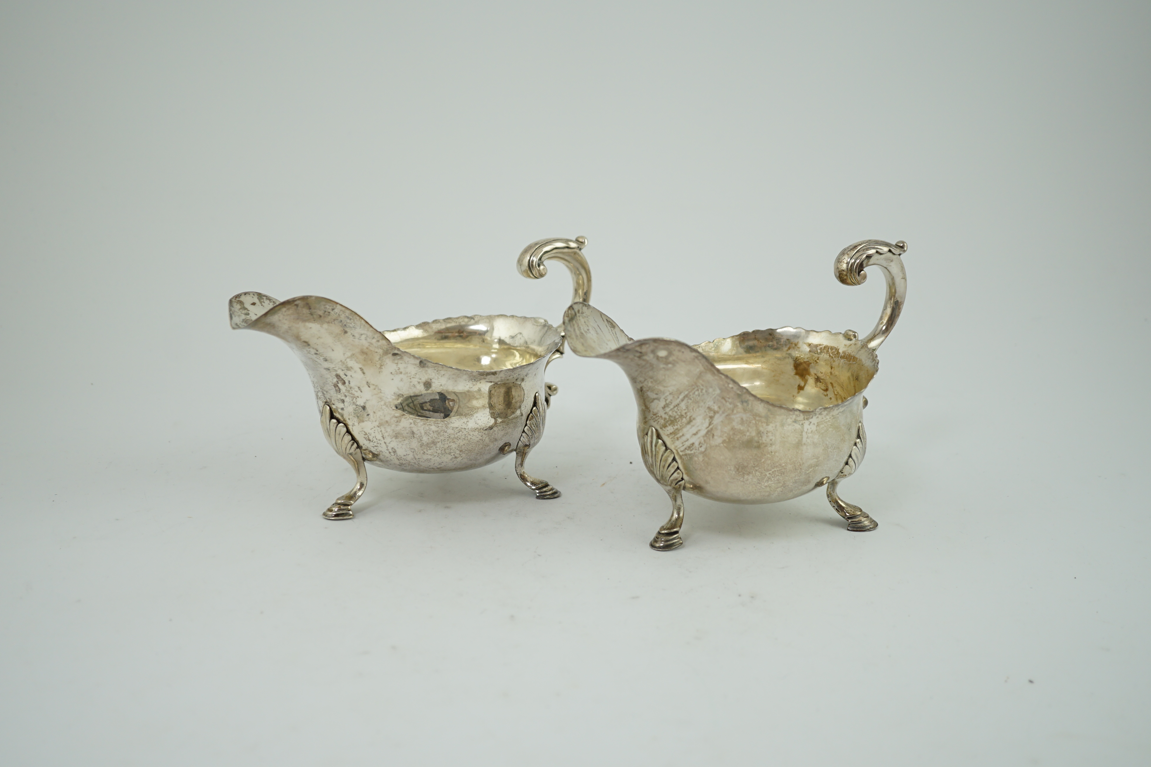 A pair of George III silver sauceboats